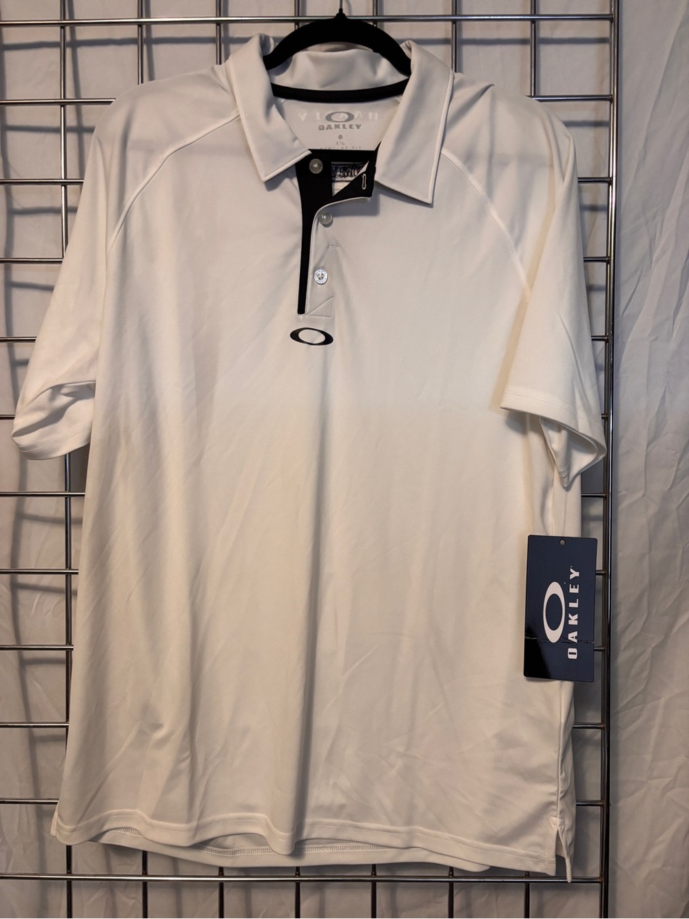 Oakley White Polo with Black Trim with Nature Valley on the back